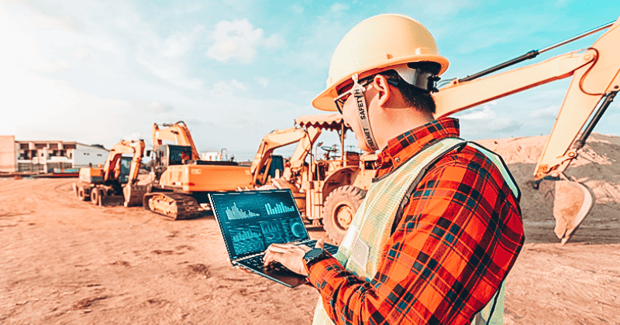 A construction field worker using equipment rental ERP to check information